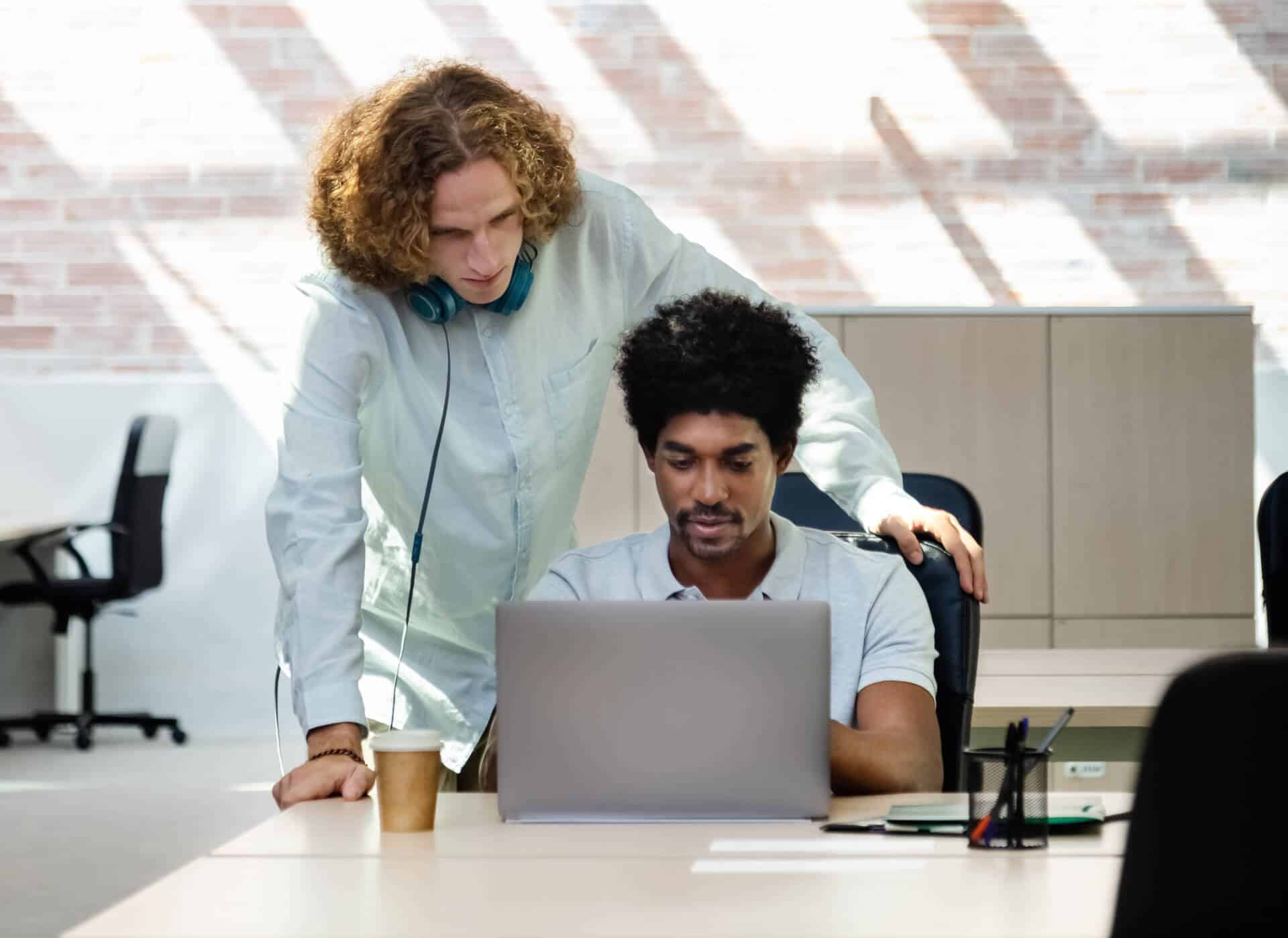 multiracial coworkers look at computer together in 2023 11 27 05 23 29 utc